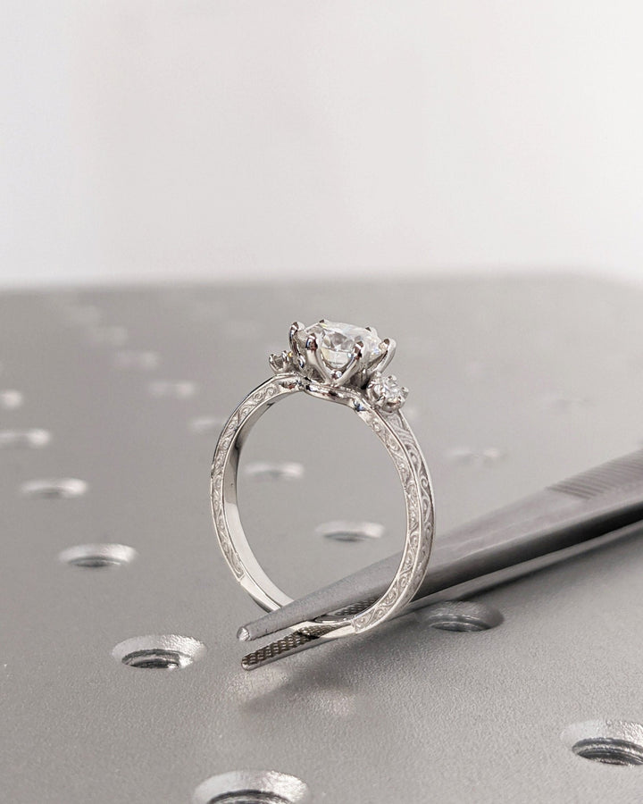Round cut engagement ring side view showing band detail