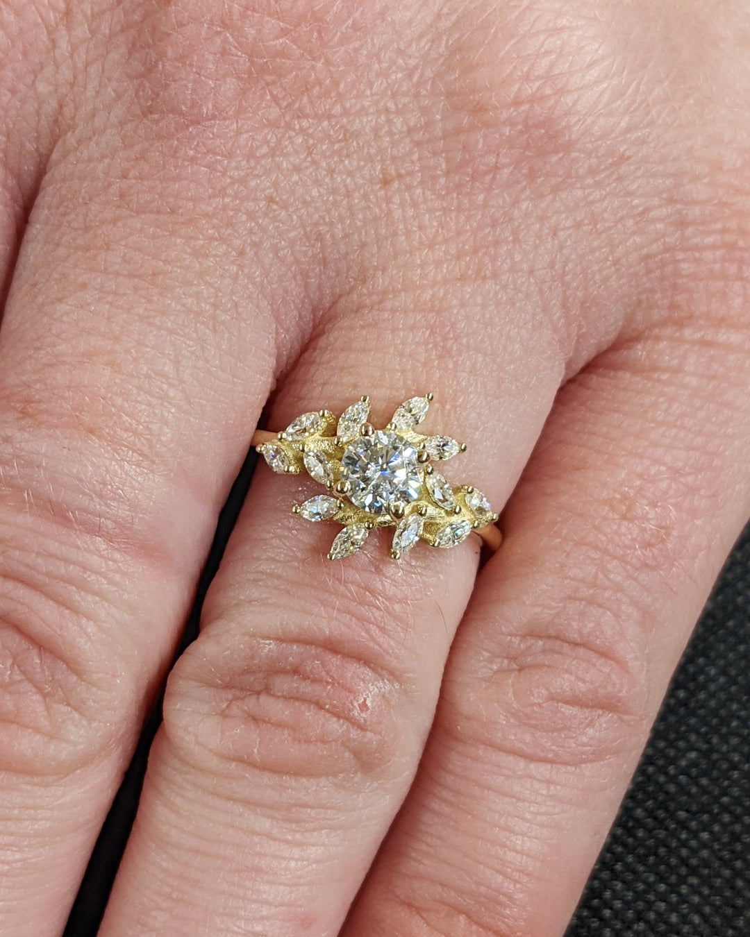 Round cluster diamond ring presented in signature gift packaging