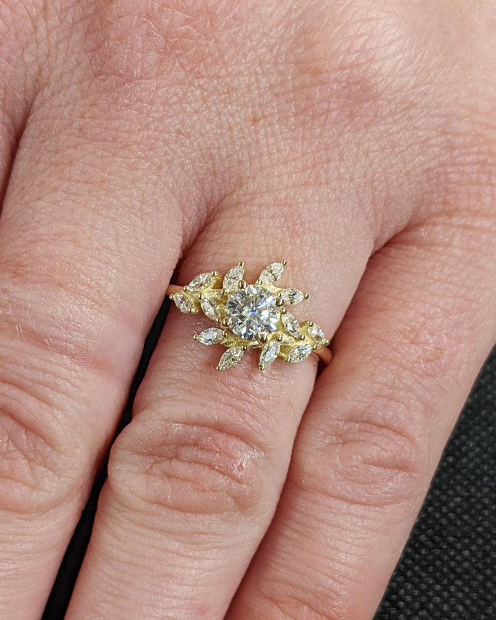 Round cluster diamond ring presented in signature gift packaging