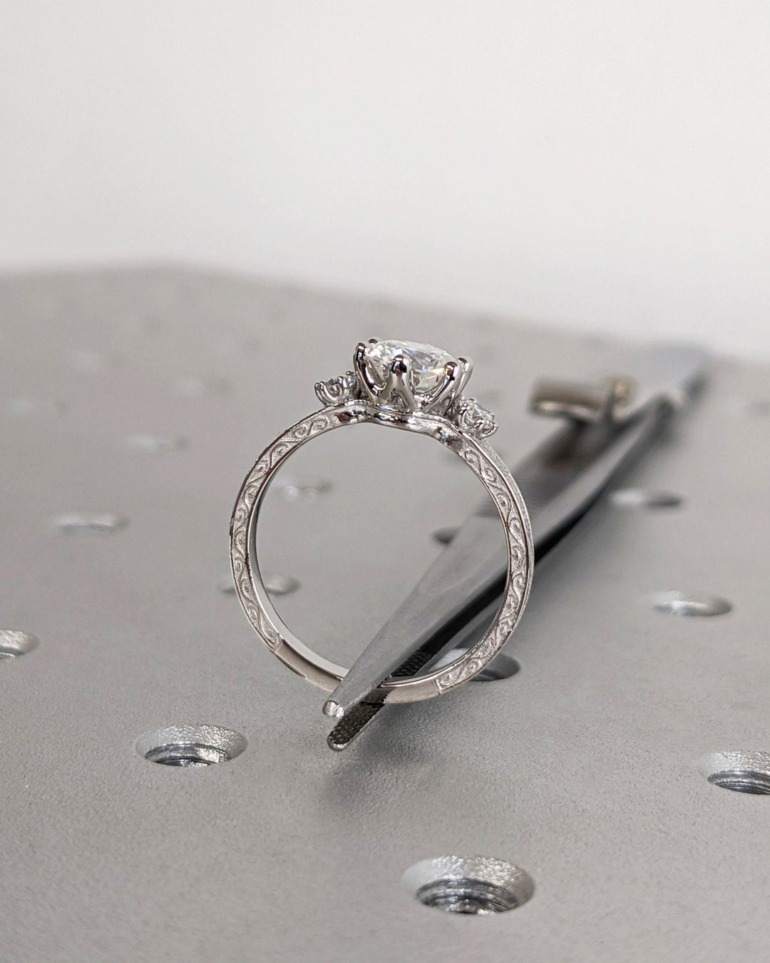 Round cut diamond ring worn on hand
