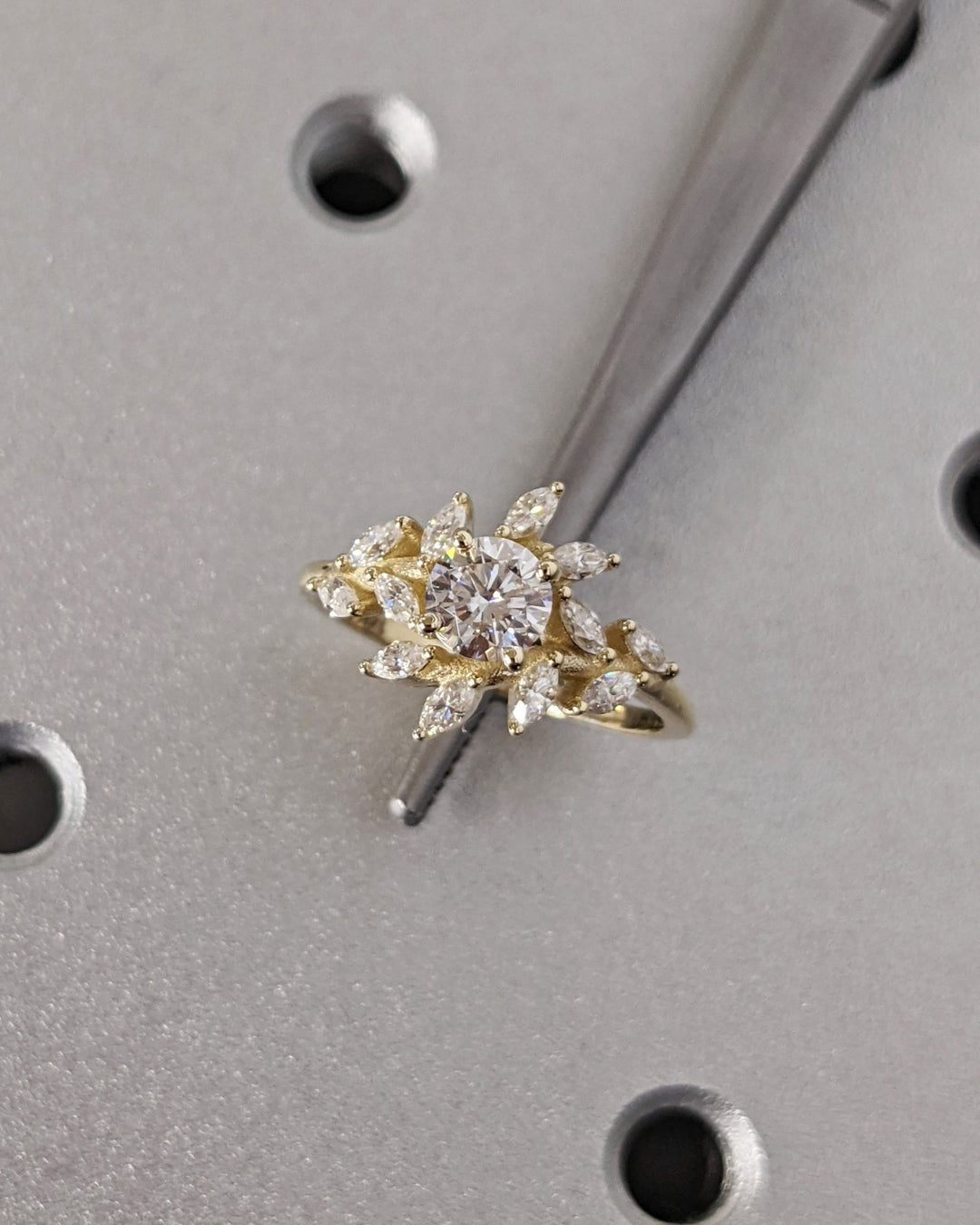 Unboxing view of round cut cluster diamond engagement ring