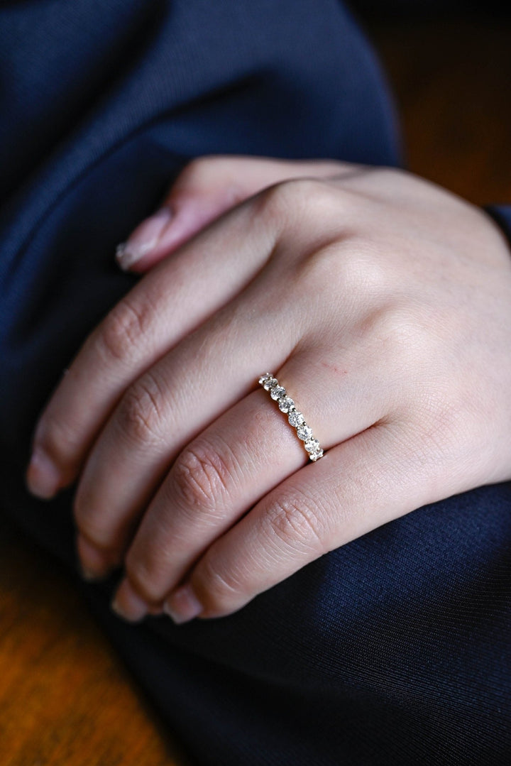 Round diamond band stacked with engagement ring