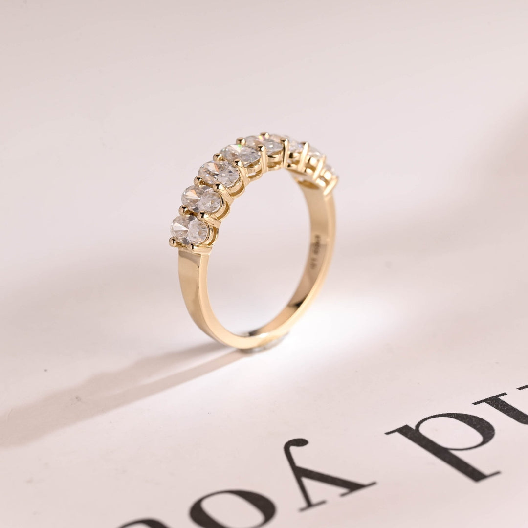 Oval diamond band stacked with engagement ring