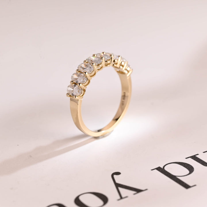 Oval diamond band stacked with engagement ring