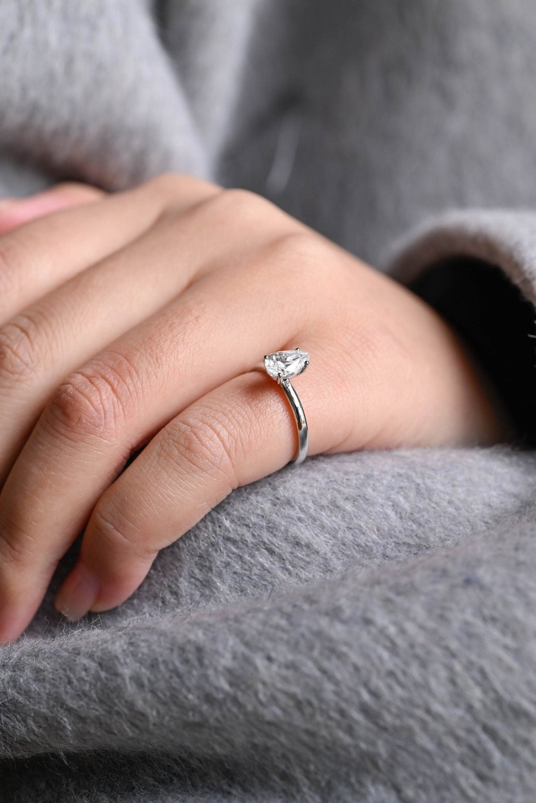Angled view of pear cut diamond in solitaire setting