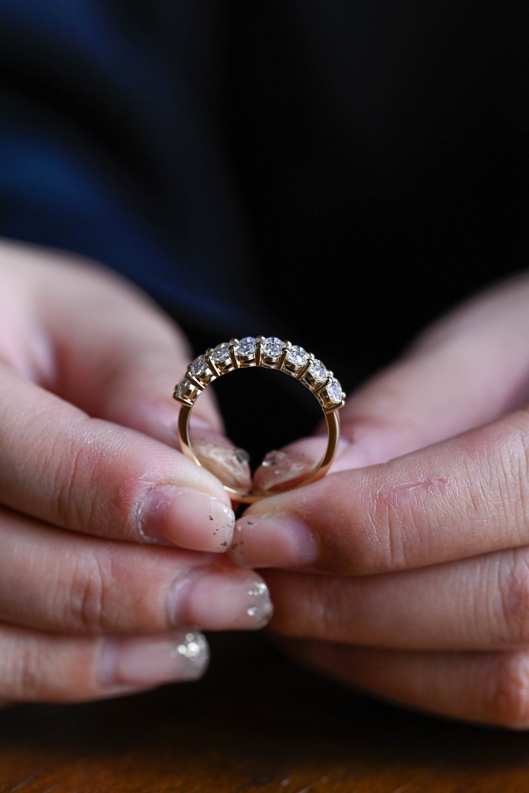 Side view of oval diamond wedding band