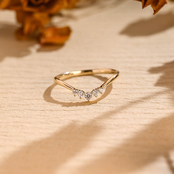 Round diamond wedding band in rose gold
