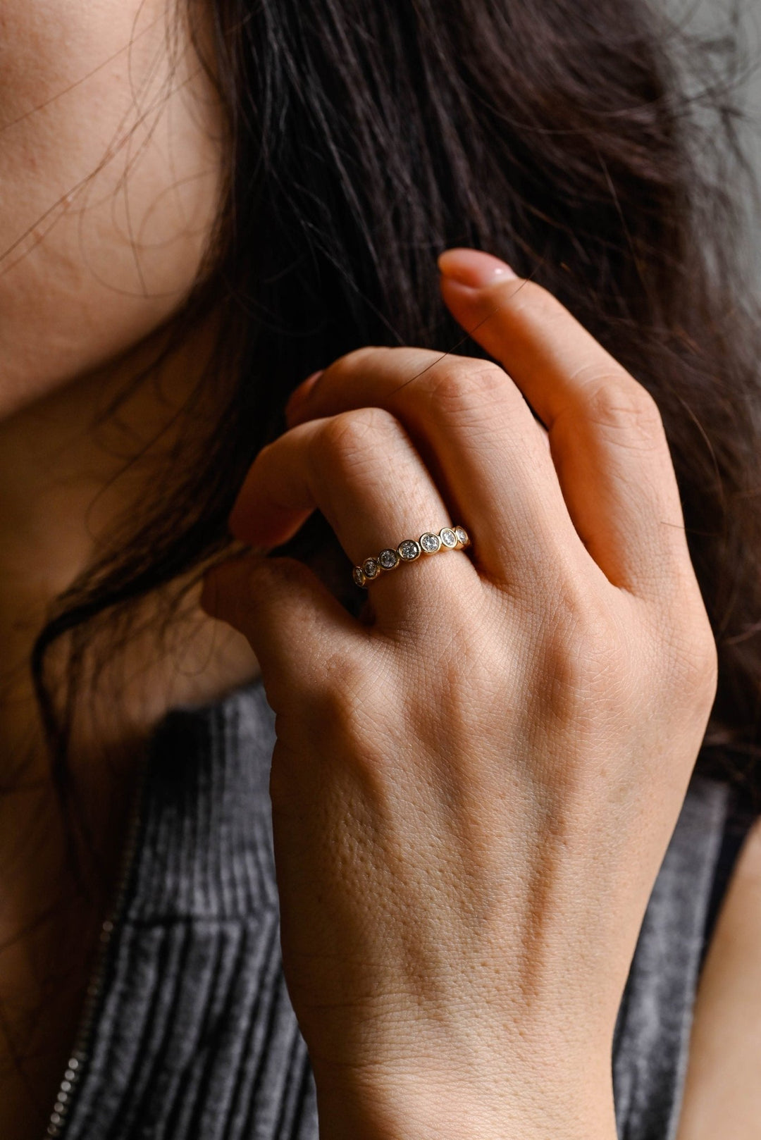 Round diamond band stacked with engagement ring