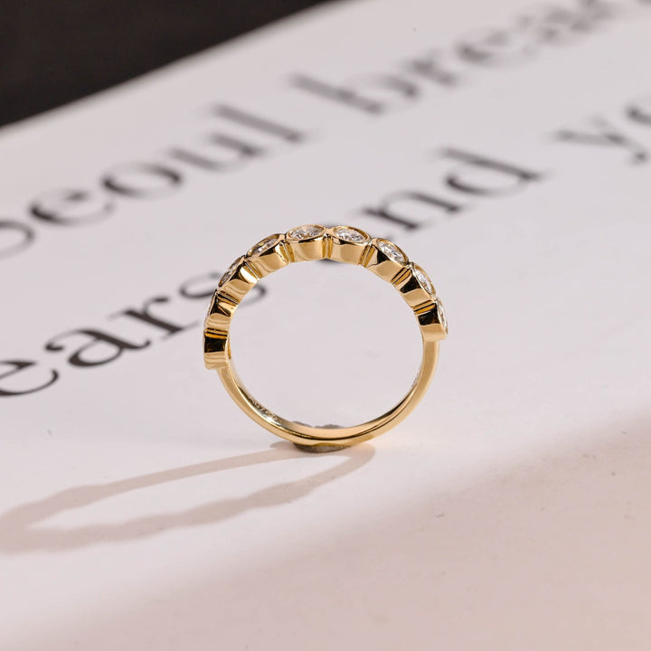 Round diamond wedding band in rose gold