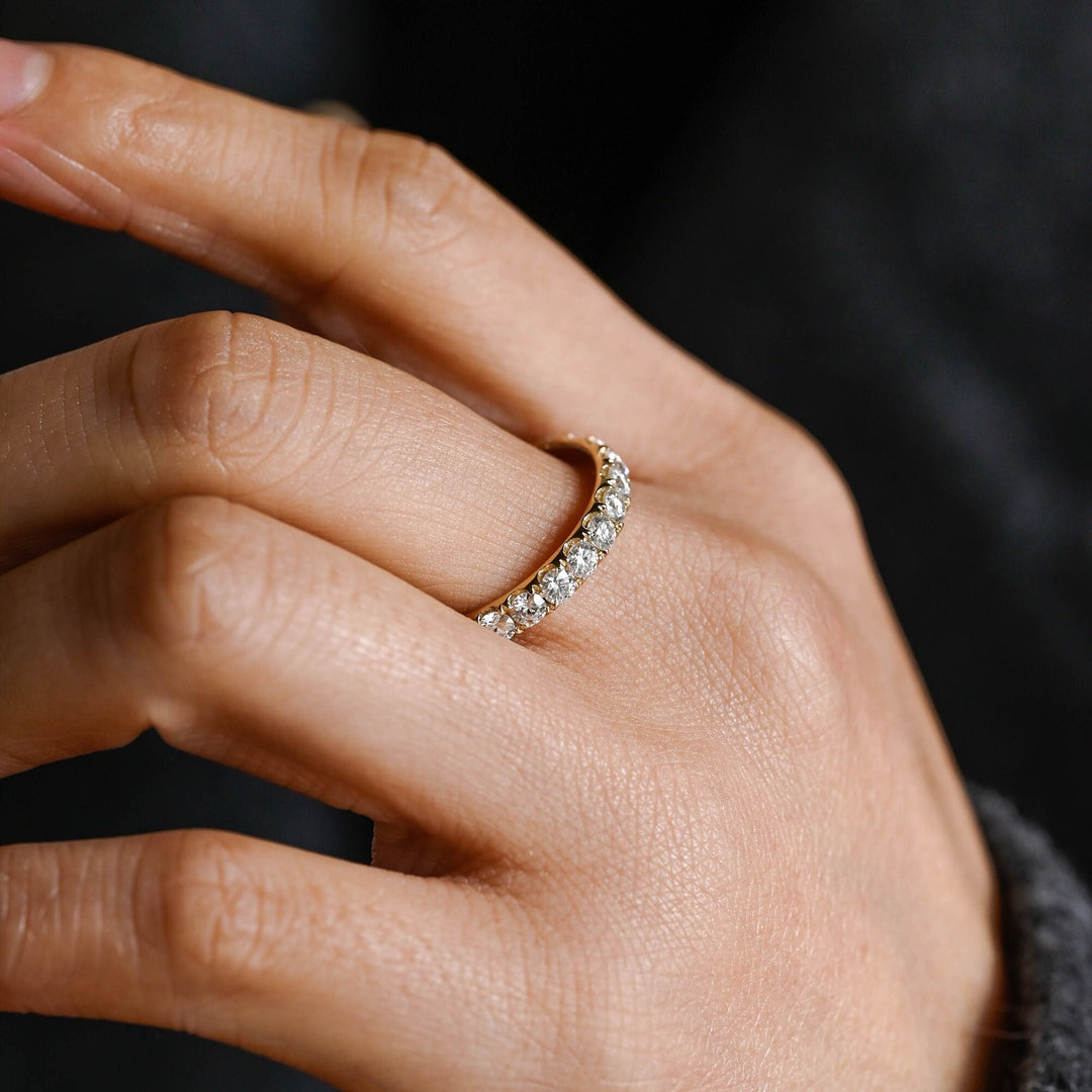 Round diamond band stacked with engagement ring