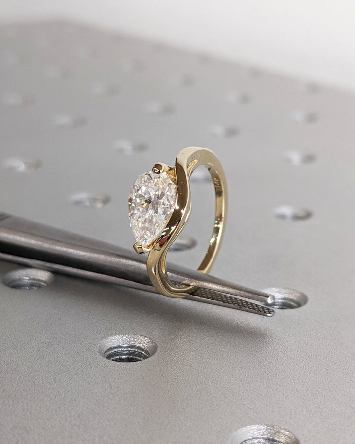 Pear solitaire engagement ring with IGI certificate and packaging