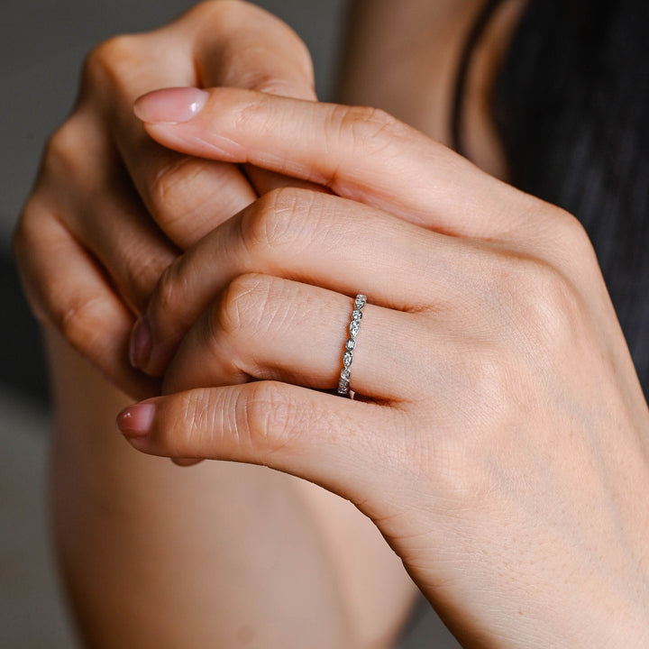 Round diamond band stacked with engagement ring