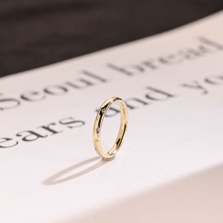Round diamond band stacked with engagement ring