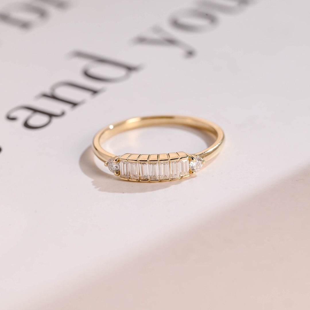 Side view of baguette & round diamond wedding band