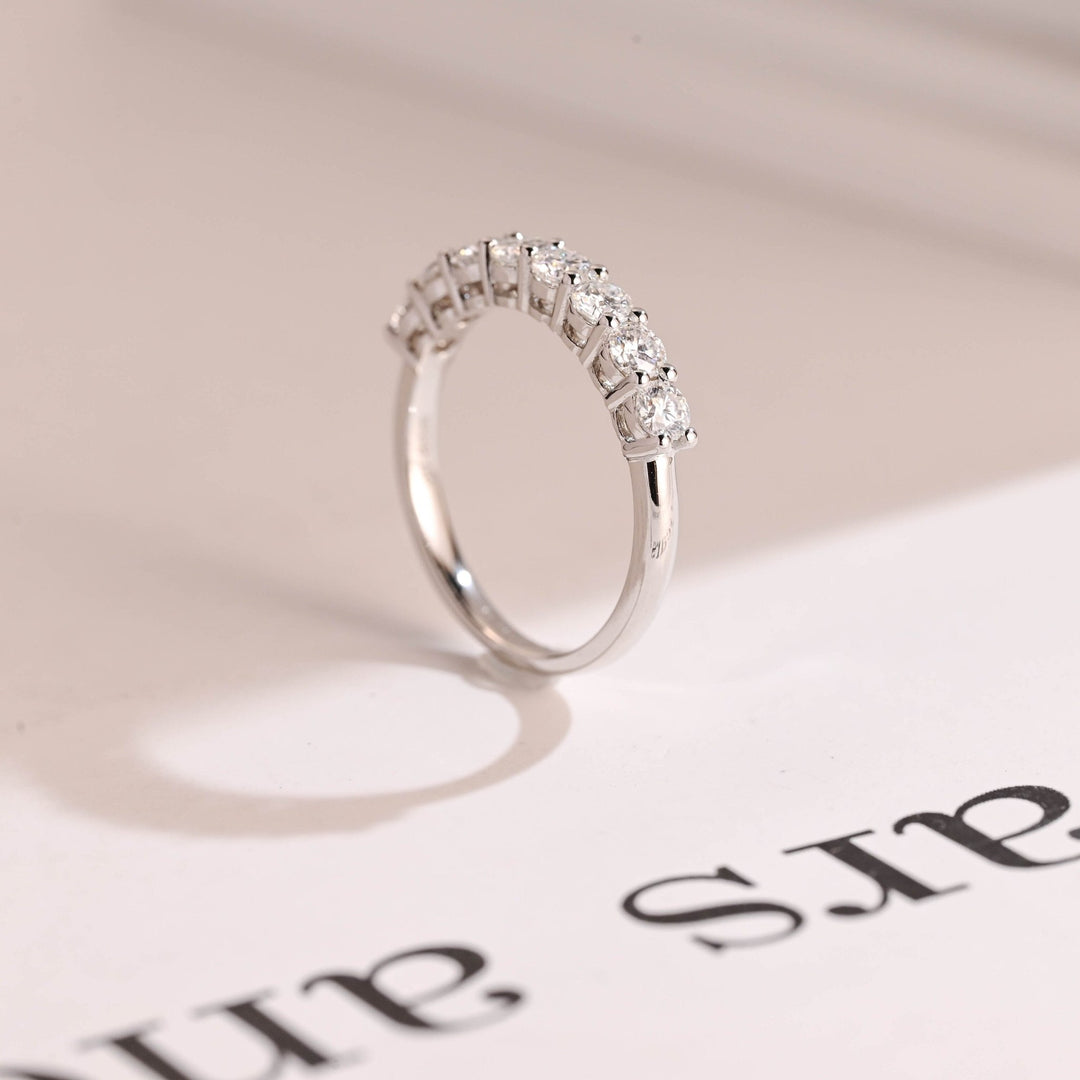 Round diamond band stacked with engagement ring