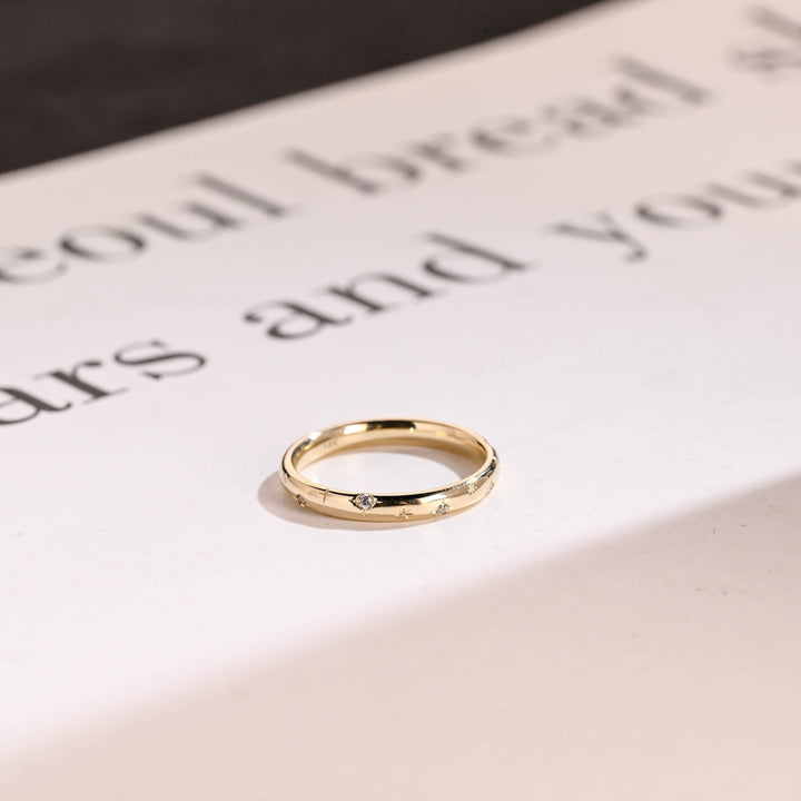 Round diamond wedding band in rose gold