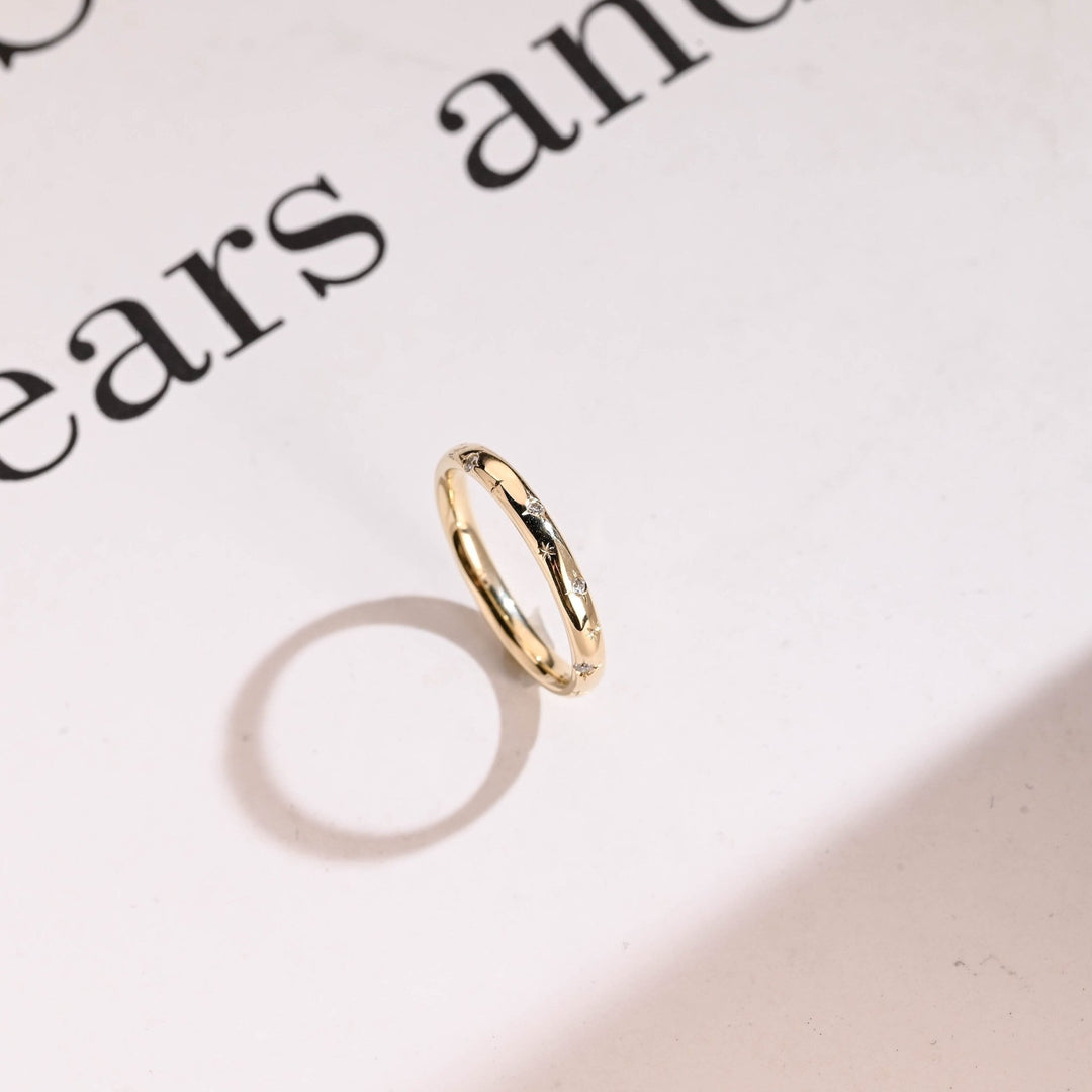Side view of round diamond wedding band
