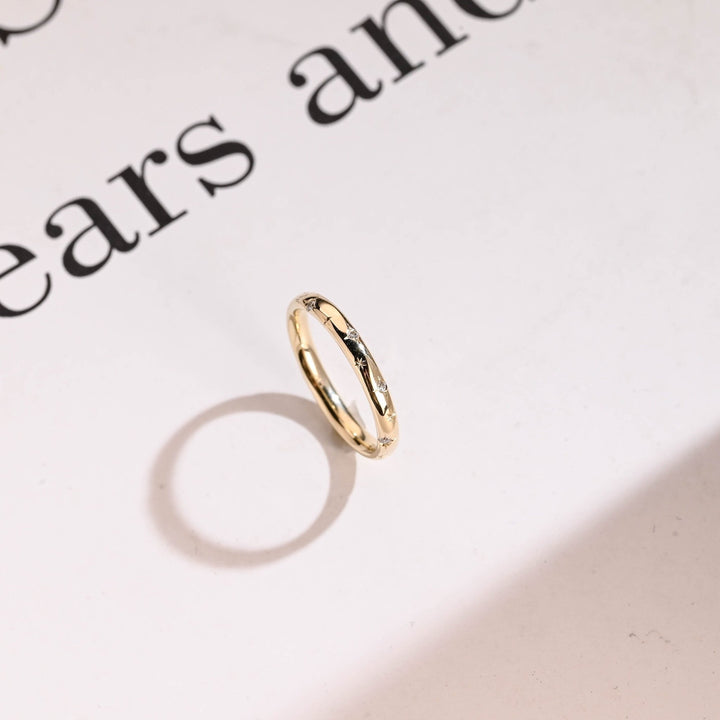 Side view of round diamond wedding band