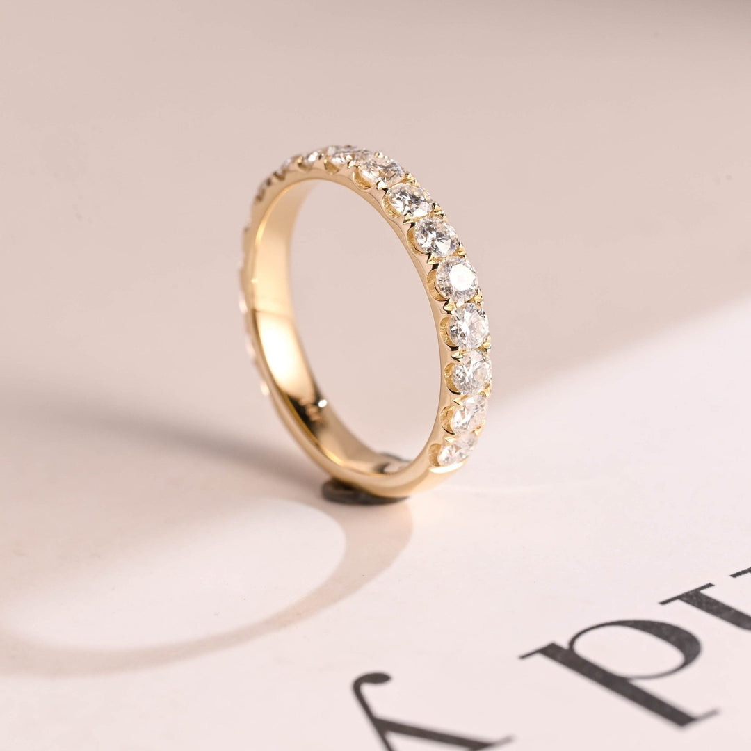 Side view of round diamond wedding band