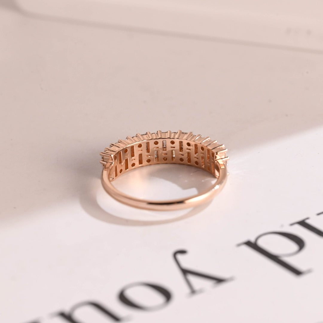 Side view of round & baguette diamond wedding band