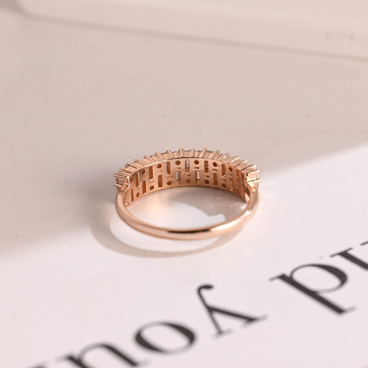 Side view of round & baguette diamond wedding band