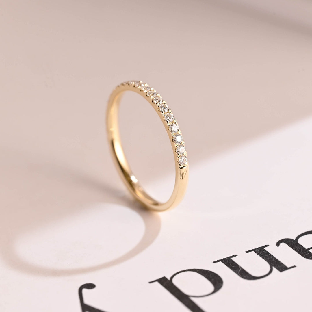 Side view of round diamond wedding band