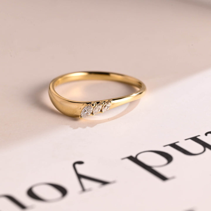Side view of marquise diamond wedding band