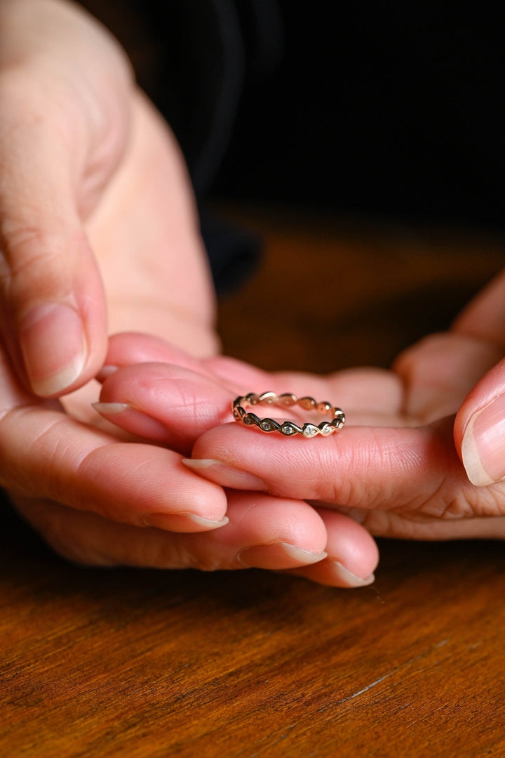Round diamond band stacked with engagement ring