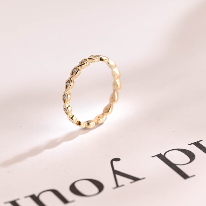 Side view of round diamond wedding band