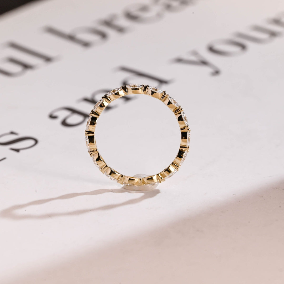 Side view of marquise diamond wedding band