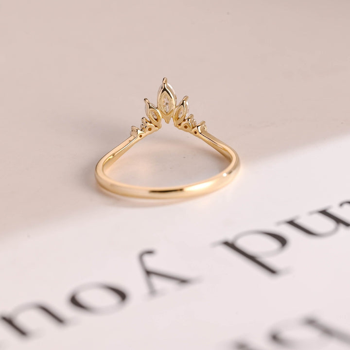 Side view of marquise & round diamond wedding band