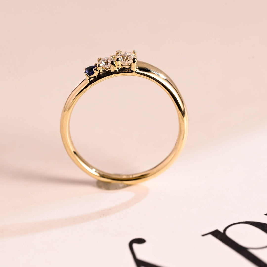 Side view of sapphire round & round diamond wedding band