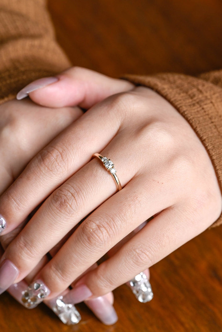Round diamond band stacked with engagement ring