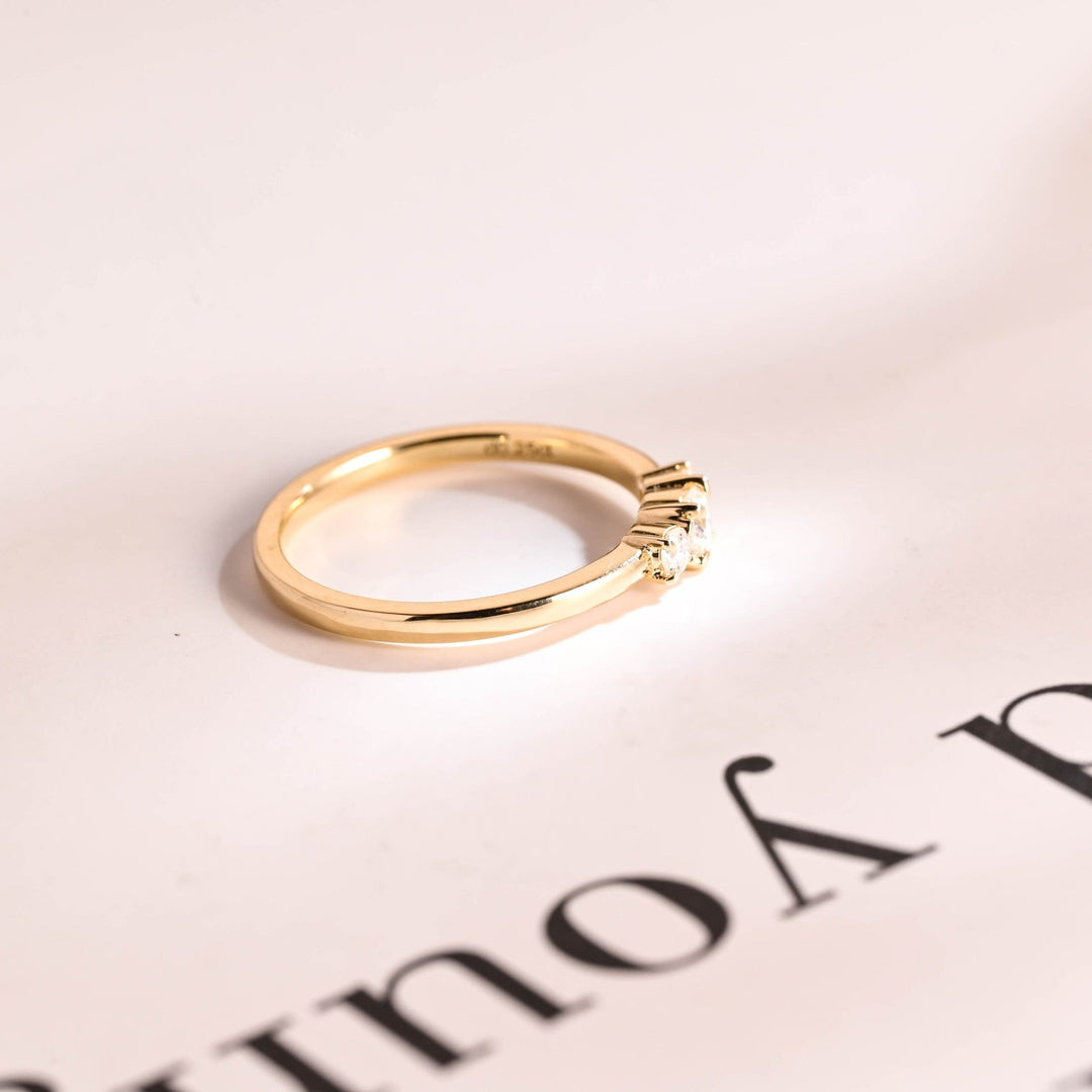 Round diamond wedding band in rose gold