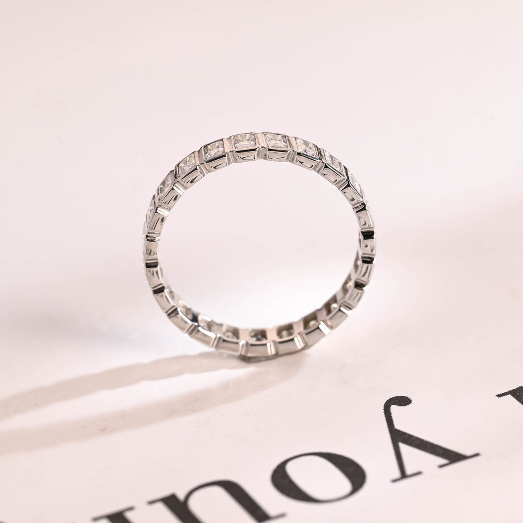 Side view of radiant diamond wedding band