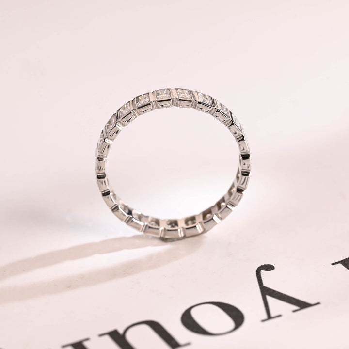 Side view of radiant diamond wedding band