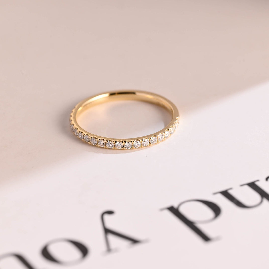 Round lab grown diamond band worn on hand