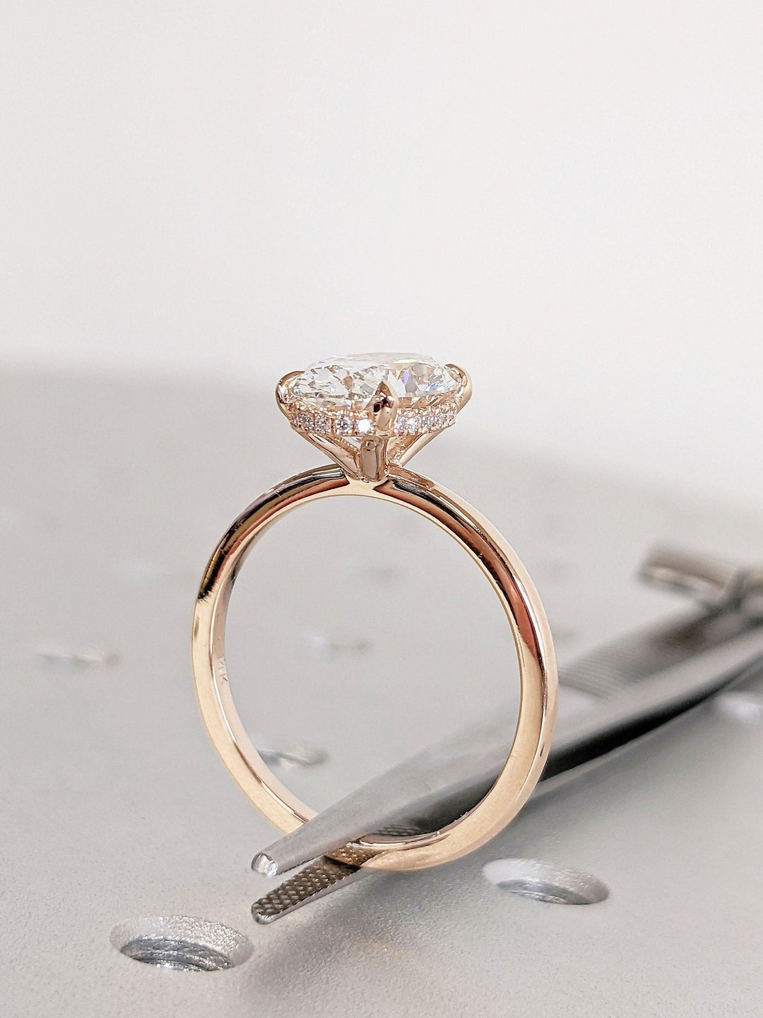 Oval hidden halo engagement ring with certified lab grown diamond