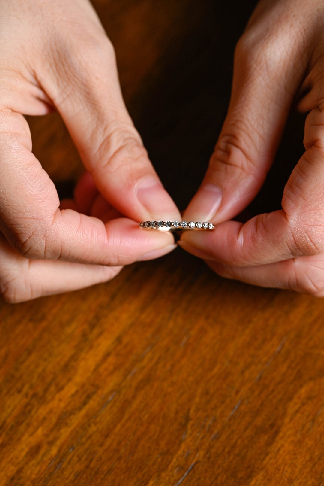 Round diamond band stacked with engagement ring
