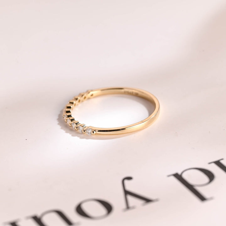 Round diamond wedding band in rose gold