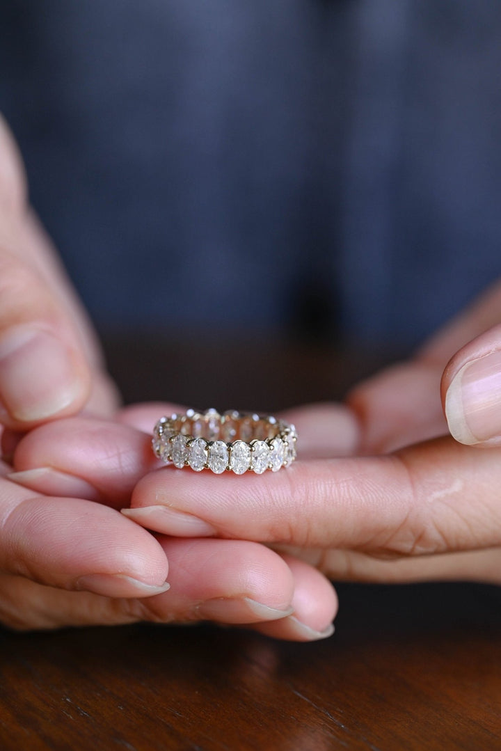 Oval lab grown diamond band worn on hand