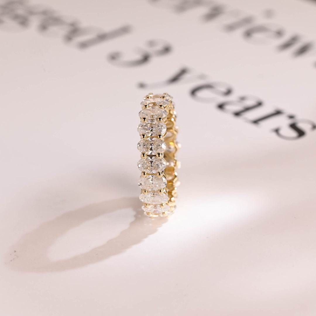 Oval diamond wedding band in rose gold