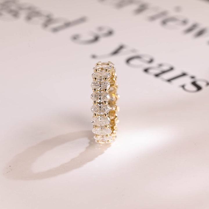 Oval diamond wedding band in rose gold