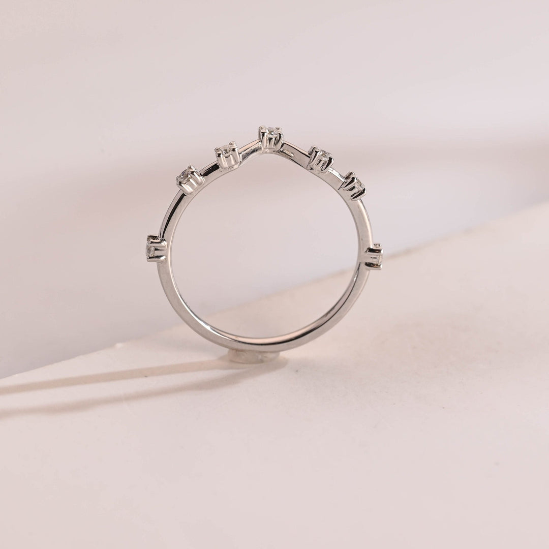 Round diamond band stacked with engagement ring