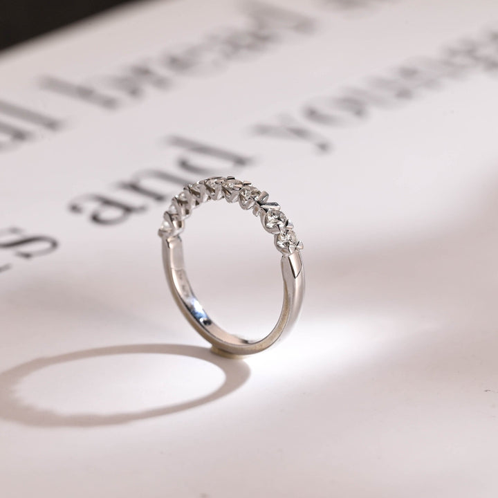 Round diamond band stacked with engagement ring
