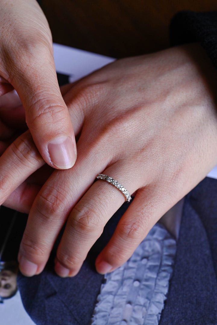 Side view of round diamond wedding band