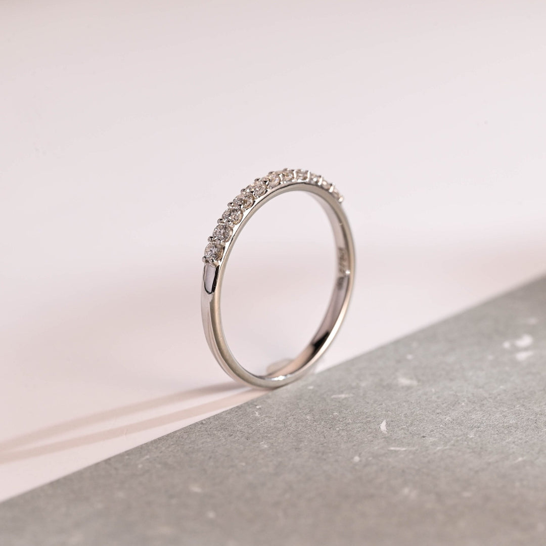 Round diamond band stacked with engagement ring