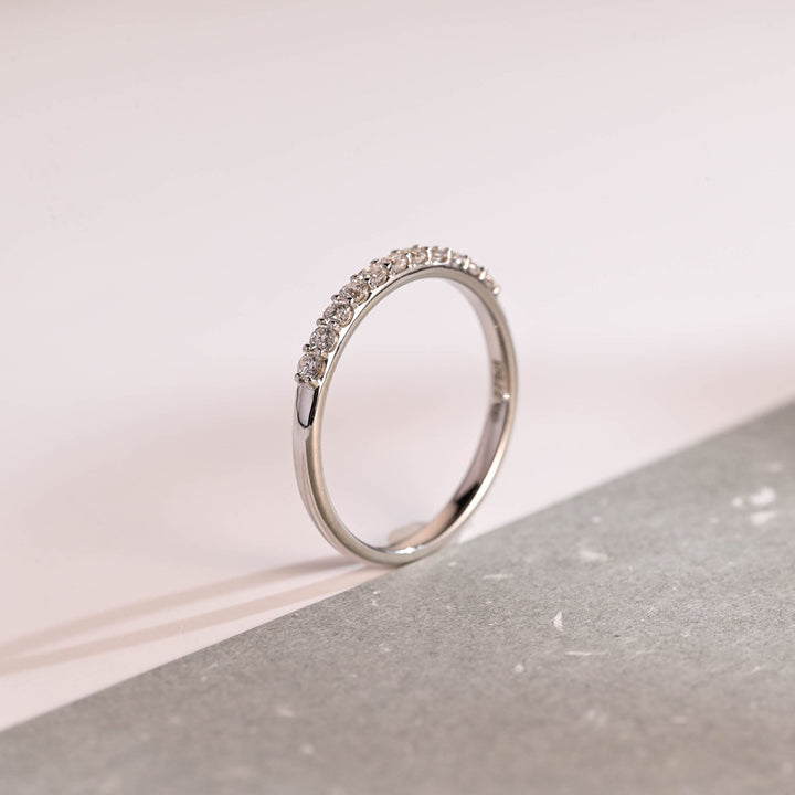 Round diamond band stacked with engagement ring