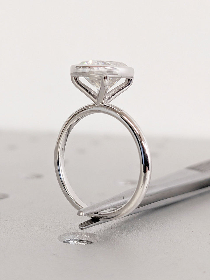 Cushion bezel engagement ring close-up showing high clarity diamond clarity