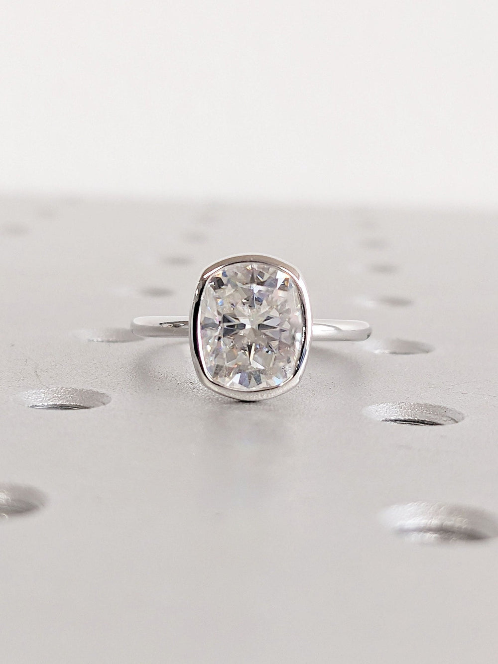 Top-down view of cushion cut bezel engagement ring